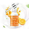Niacinamide and Vitamin C Dark Spot Serum in an elegant dropper bottle with citrus elements.