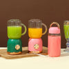 Portable USB Rechargeable Double Cup Juicer with green and yellow smoothies in cups and a pink bottle.