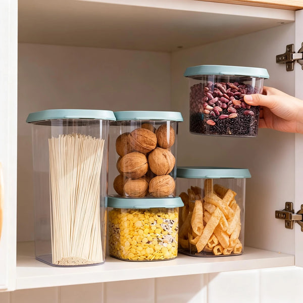 Dry Food Storage Container with Lid holding various dry pantry staples like pasta, nuts, and snacks in organized cupboard.
