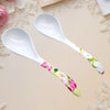 Two Ceramic Flower Handle Soup Spoons stylishly displayed on a light surface, showcasing elegant floral designs.