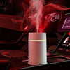 The Mini 420ml USB Air Humidifier releasing mist in a modern car interior with a sleek design.