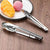 3-Piece 12-Inch Stainless Steel BBQ Tong Set next to desserts on a plate, highlighting their versatile use.