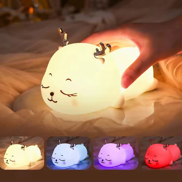 Cute Deer RGB Colorful Pat Control Night Light glowing softly as hand touches it.