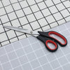 11-inch Stainless Steel Clothing Scissors on fabric for precision cutting.