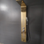 Golden Stainless Steel LED Shower Panel System elegantly mounted on a modern bathroom wall.