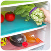 Multi-Purpose Anti-Slip Shelf & Fridge Mat 6-Pack featuring fresh vegetables and drinks organized in a refrigerator.