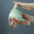 200ML Wireless Mini Electric Food Chopper Garlic Mincer in use, chopping red peppers efficiently.