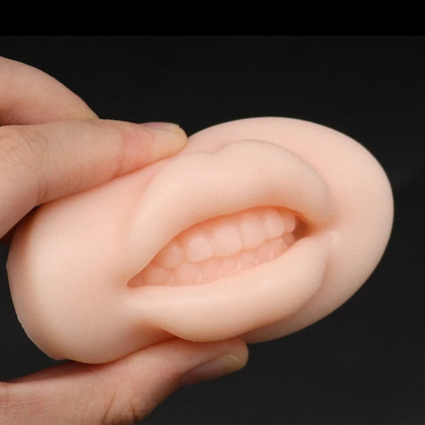 Silicone Lip Tattoo Practice Skin held in hand, showcasing realistic lip contours for permanent makeup training.