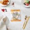 Classic 5 Piece Stainless Steel Cookie Cutter Set displayed with croissants and macarons on a marble table.