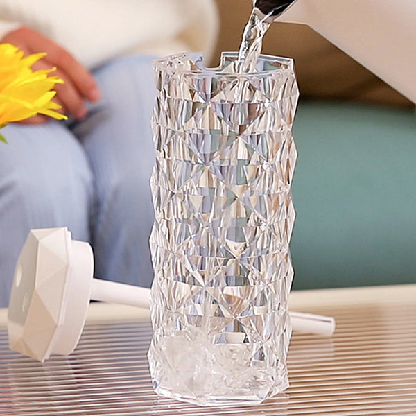 Crystal Table Lamp Air Humidifier pouring water into a stylish crystal container, enhancing home decor and air quality.