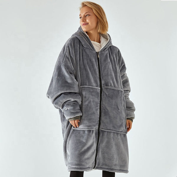 Oversized Sherpa Wearable Hoodie Blanket worn by a model, showcasing the cozy and plush design in gray.