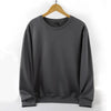 Unisex Oversized Blank Hoodies in grey hanging on a wooden hanger.
