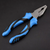 Multi Function Combination Pliers with PVC Handle on a black background, showcasing the ergonomic design.