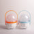 Rechargeable Outdoor LED Camping Lantern in pink and blue with handles, ideal for camping and power outages.