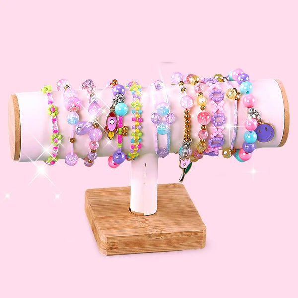 Colorful bracelets displayed on a stand from the DIY Girls Bracelet Making Kit with Beads & Charms.