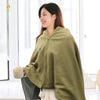 Woman wearing a Wearable USB Heated Shawl for Winter while holding a cup, showcasing comfort and warmth in a cozy indoor setting.