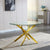 Luxury Round Dining Table with glass top and golden cross base in modern dining space.