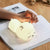 Cute Deer RGB Colorful Pat Control Night Light in use atop a book with a hand gently touching it.