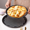 Non-Stick Carbon Steel Baking Cake Mold with freshly baked pizza on top, showcasing its non-stick properties.