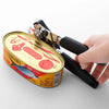 Stainless Steel Manual 3-in-1 Can Opener opening a canned food, demonstrating its ergonomic grip and cutting wheel.