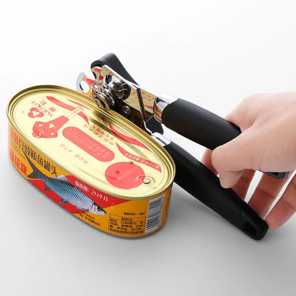 Stainless Steel Manual 3-in-1 Can Opener opening a canned food, demonstrating its ergonomic grip and cutting wheel.