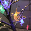LED moon and star Ramadan string hanging light illuminating a decorative tree branch in vibrant colors.