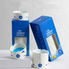 Disposable Ashtray Cups for Home & Office Use packaging and individual cups displayed on a clean surface.