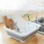 Collapsible Dish Drainer Dinnerware Portable Folding Rack with dishes and utensils in a kitchen setting.