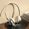 Portable ENC Noise Reduction Over-Ear Headphones resting on a vinyl record, showcasing sleek design and comfort.