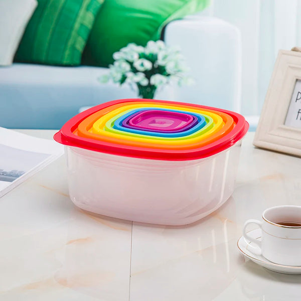 7-Piece Stackable Rainbow Food Storage Container Set with colorful lids stacked in a kitchen setting.
