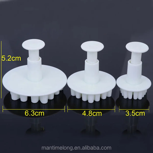 Snowflake Plunger Cookie Cutter Set featuring three sizes with plunger mechanism for easy cake and cookie decorating.