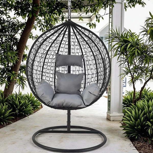 Grey Garden Outdoor Hanging Chair in a serene outdoor setting surrounded by greenery.