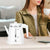 Borosilicate Double Wall Glass Electric Kettle on a desk with a woman enjoying coffee.