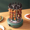 Electric Outdoor Rotisserie BBQ Grill with skewers of meat and vegetables on a wooden table.