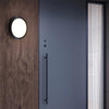 Waterproof Outdoor LED Corridor Ceiling Lamp mounted by a modern door on a wooden wall.
