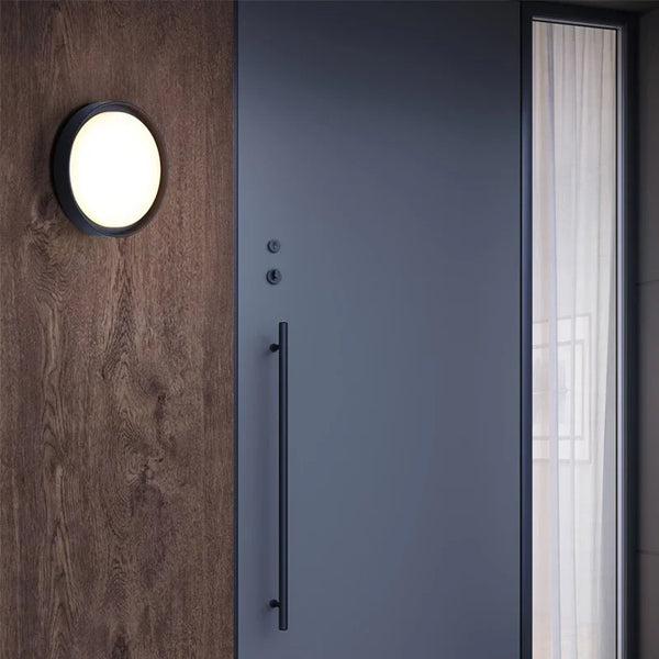 Waterproof Outdoor LED Corridor Ceiling Lamp mounted by a modern door on a wooden wall.