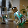 Desktop Portable Bulb Humidifier in a stylish bulb shape, enhancing air moisture with a decorative design.