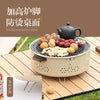 Portable Charcoal Grill & Outdoor Cooker with tea kettle and assorted snacks on a wooden table.