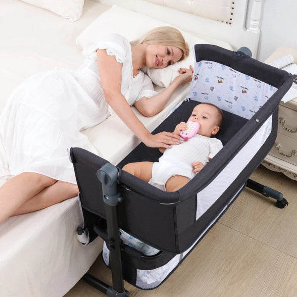 Image of a woman lying beside an infant in an Adjustable Multifunction Baby Swing Bed Cradle for safe and soothing rest.