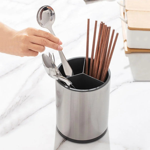 360 Rotating Stainless Steel Utensil Holder with cooking tools and chopsticks on a kitchen countertop.