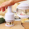 Stainless Steel Manual Food Chopper Handheld Vegetable Onion Press in use, chopping vegetables.