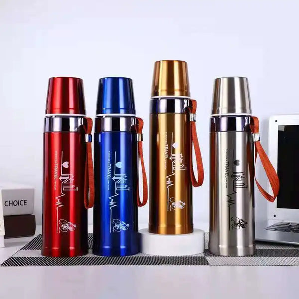 Four 600ml Stainless Steel Thermos Bottles in red, blue, gold, and silver displayed on a table.