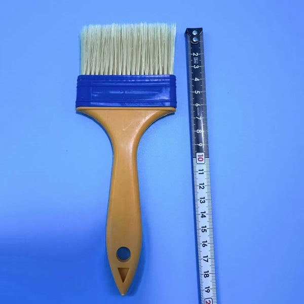 Professional 3 Inch Nylon Paint Brush with synthetic bristles next to a ruler for size reference.