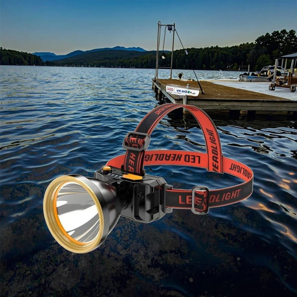 Super Bright LED Headlamp with Safety Warning Light on a scenic lake shore.