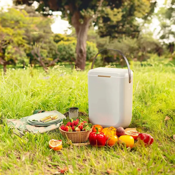 10L Premium Insulated Travel Cooler Box with fruits and picnic items in a grassy outdoor setting.