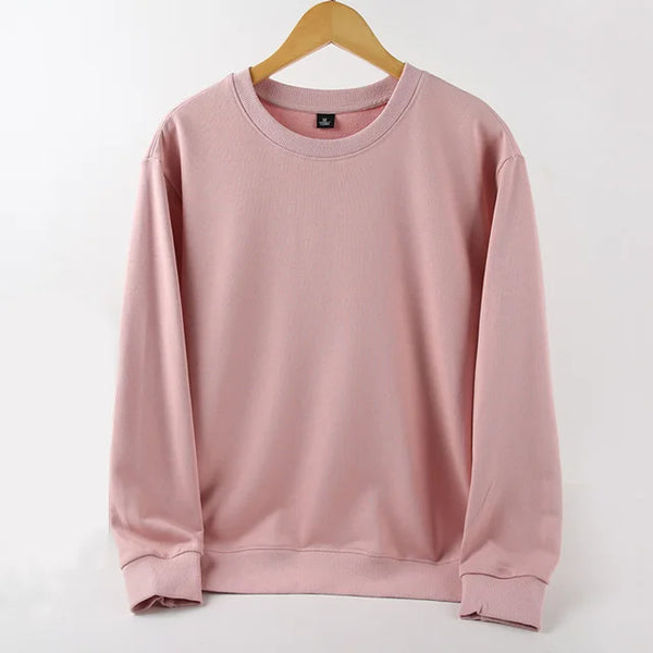 Unisex Oversized Blank Hoodies in soft pink fabric displayed on a hanger.