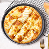 Delicious cheese pizza in a Non-Stick Carbon Steel Baking Cake Mold on a wire rack.
