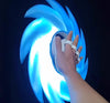 Person holding a 3D Printed Glowing Rotatable Ace Ring Toy with vibrant blue light effect.