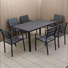 Outdoor Teak and Aluminium Dining Table with 4 Armchairs in an outdoor setting.