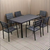 Outdoor Teak and Aluminium Dining Table with 4 Armchairs in an outdoor setting.
